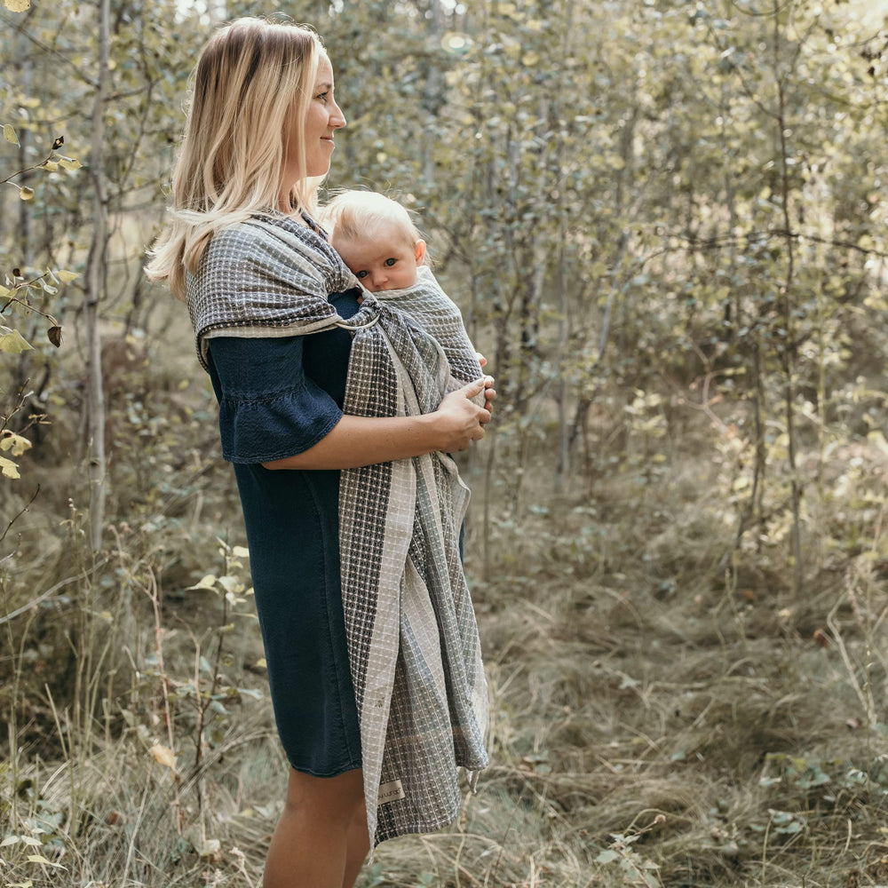 Hip Baby Wrap ergonomic design shows even weight distribution across caregiver