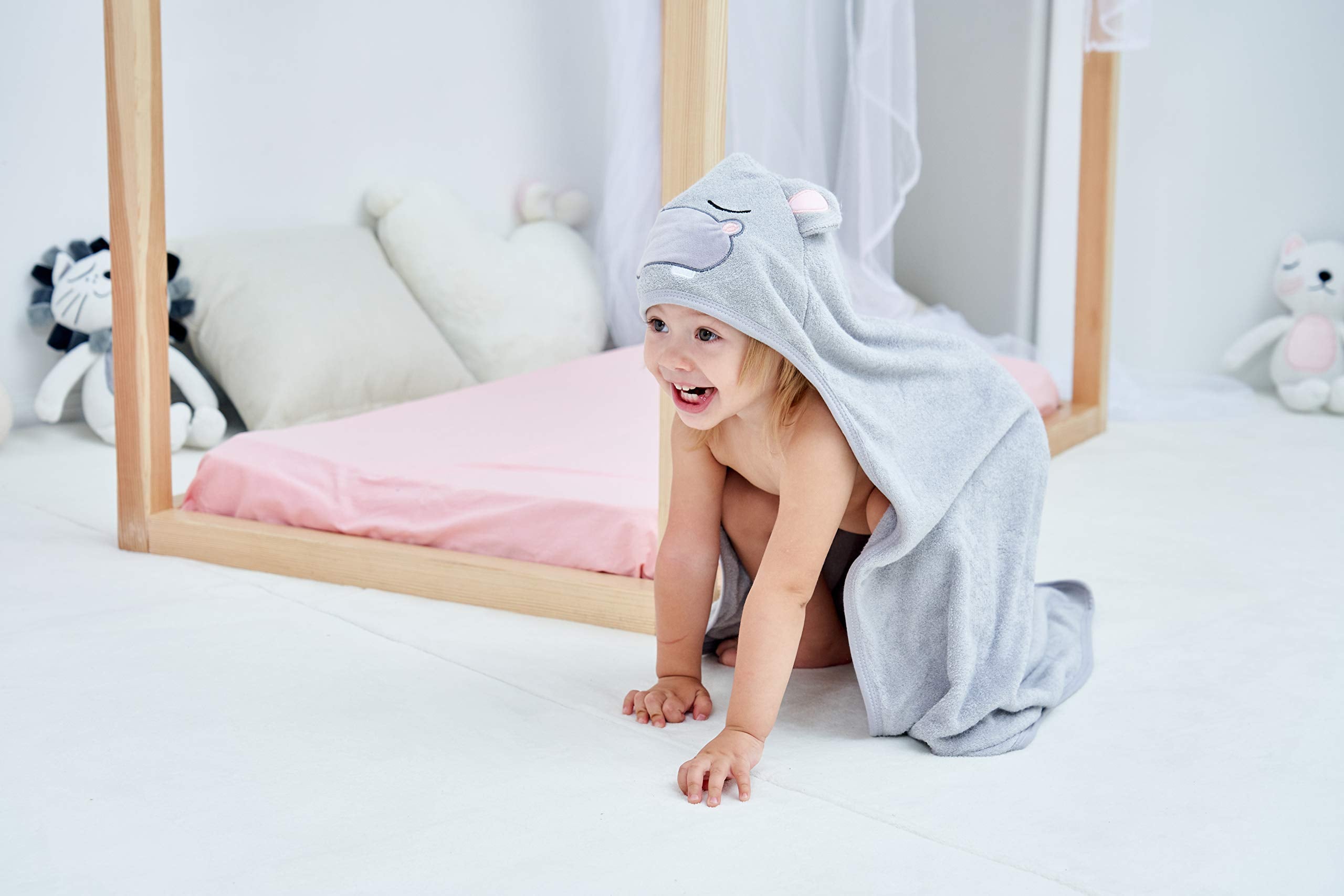 HIPHOP PANDA bear-ears hooded towel on baby, inviting cuddle after bath.