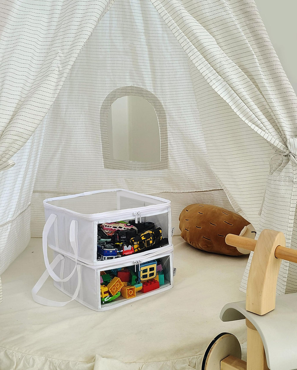 Holay storage bin with handles for easy carrying around the home.