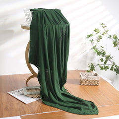 Hollyoo muslin swaddle blanket green closeup fiber highlighting breathable viscose fabric