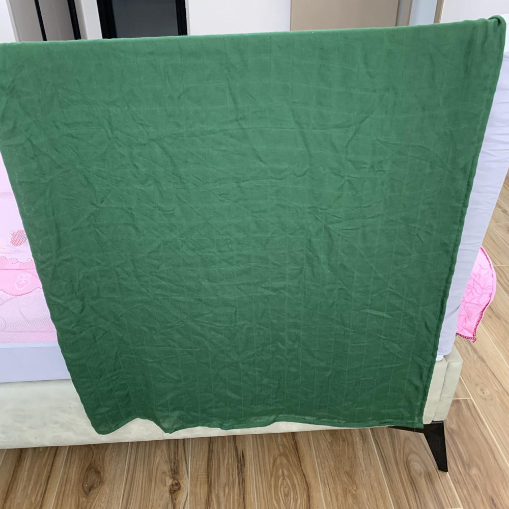 Hollyoo muslin swaddle blanket green wrapped baby demonstrates snug, secure swaddle