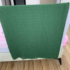 Hollyoo muslin swaddle blanket green wrapped baby demonstrates snug, secure swaddle