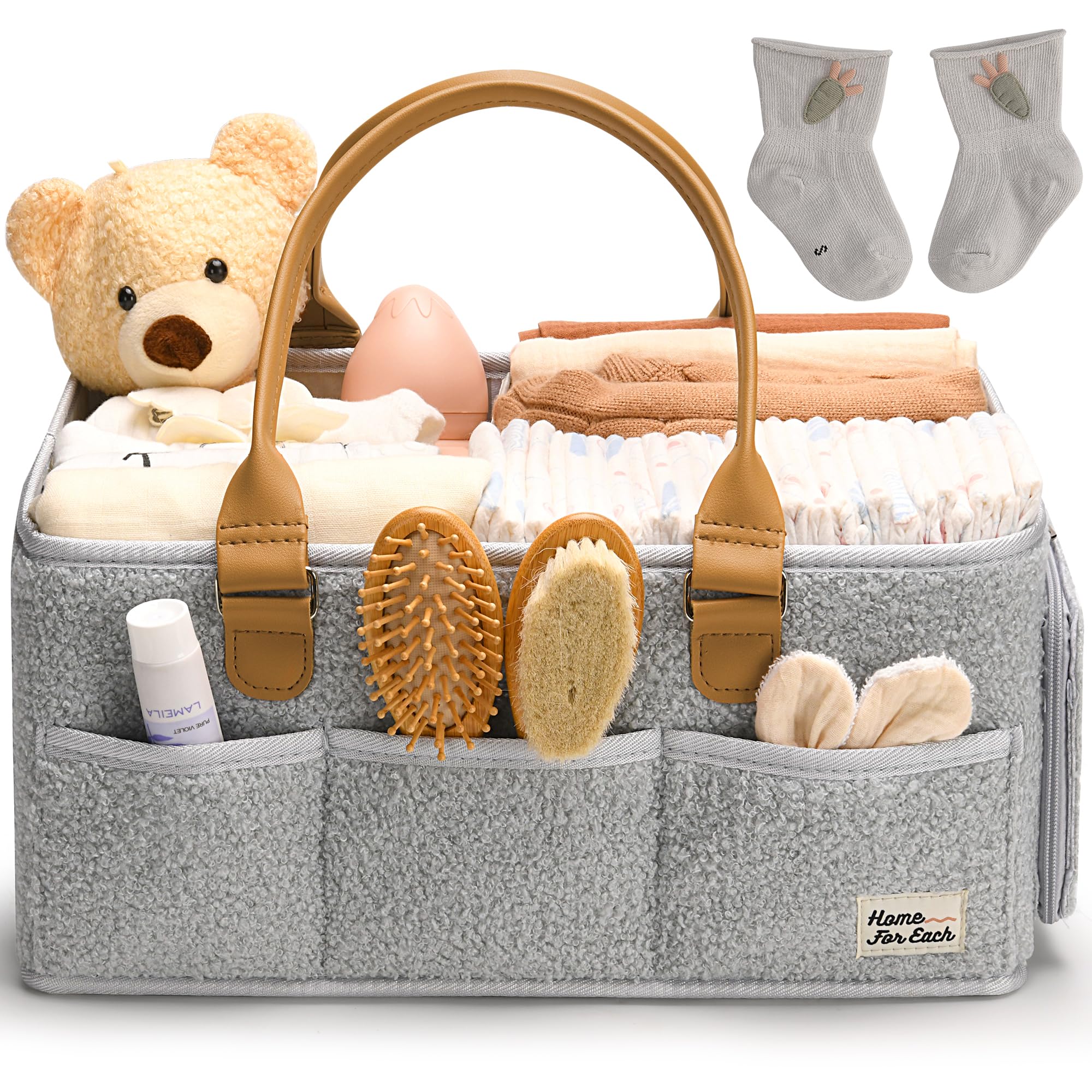 HOME FOR EACH diaper caddy with handle keeps nursery essentials within reach.