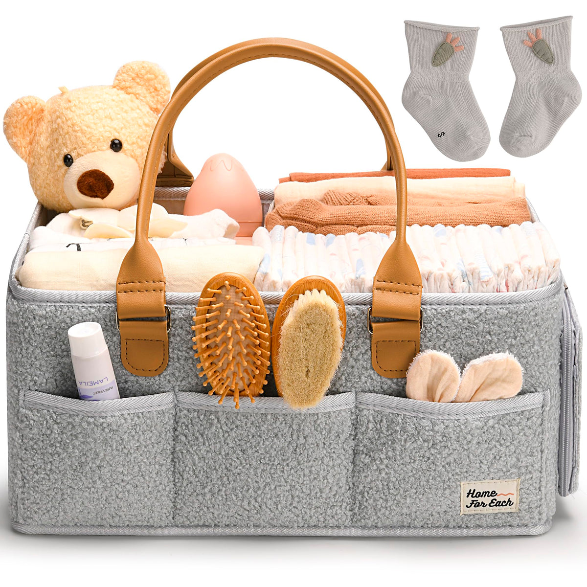 HOME FOR EACH diaper caddy with handle keeps nursery essentials within reach.
