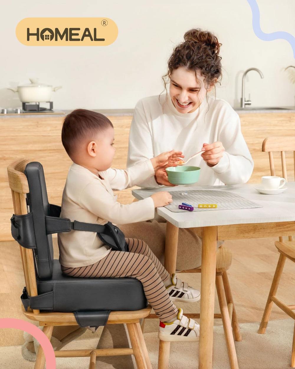 HOMEAL booster seat front buckle detail demonstrates quick fastening for worry-free meals