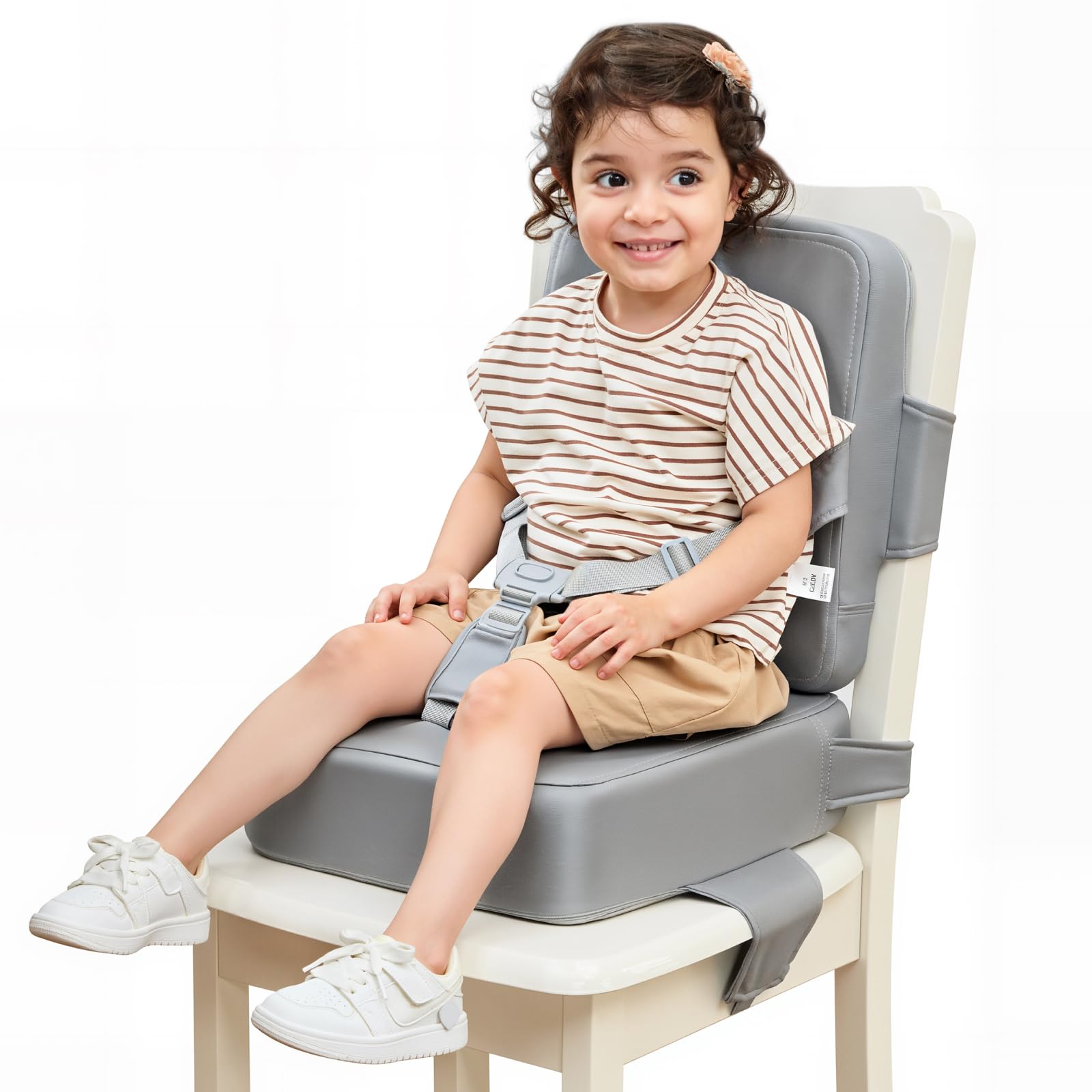 HOMEAL booster seat on a kitchen chair shows secure straps for safe toddler meals.