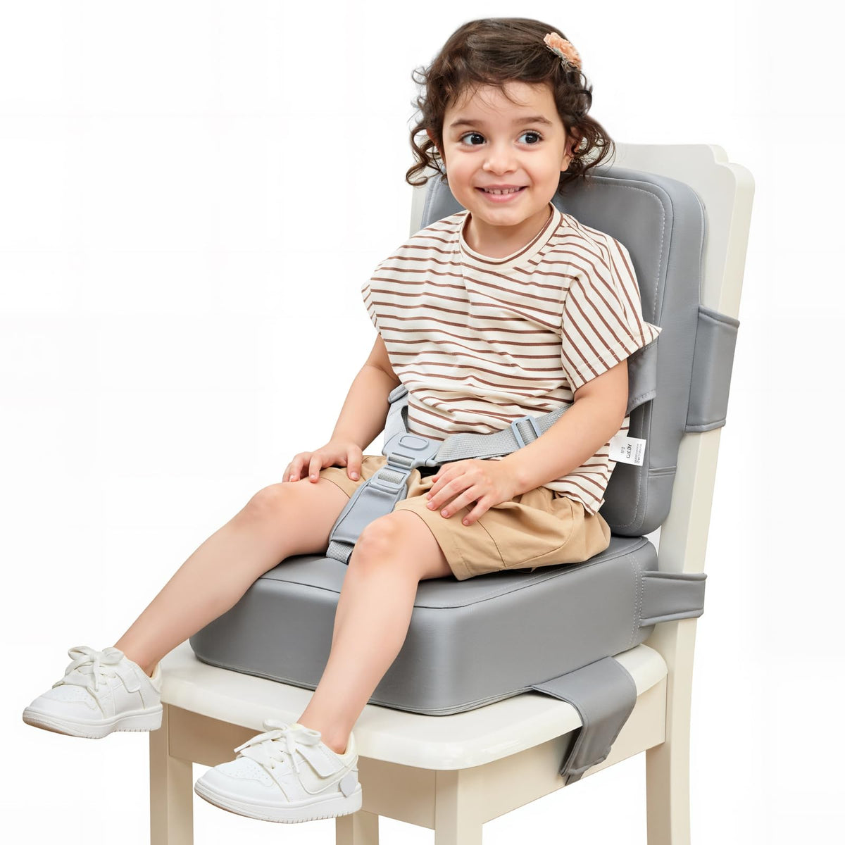 HOMEAL booster seat on a kitchen chair shows secure straps for safe toddler meals.