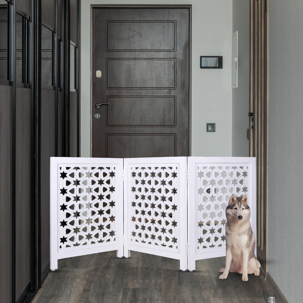 Homebia Designs wooden pet gate folded for compact storage after use.