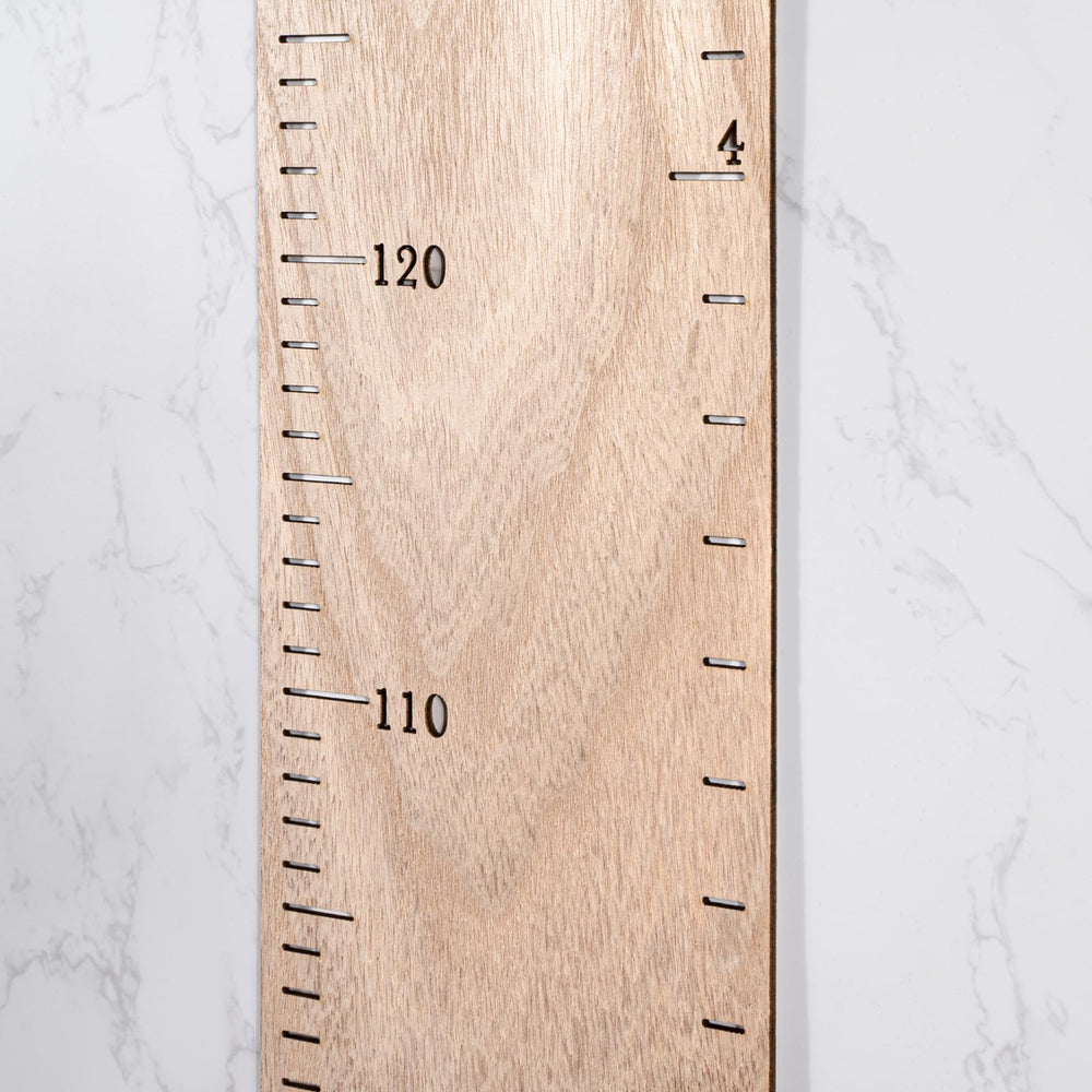HOMEE growth chart patchwork design displayed as customizable wall decor.