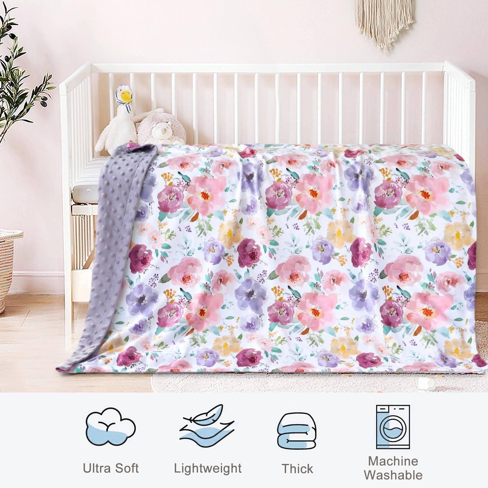 HOMRITAR nursery decor image showcases the blanket's vibrant floral design in a crib setup.