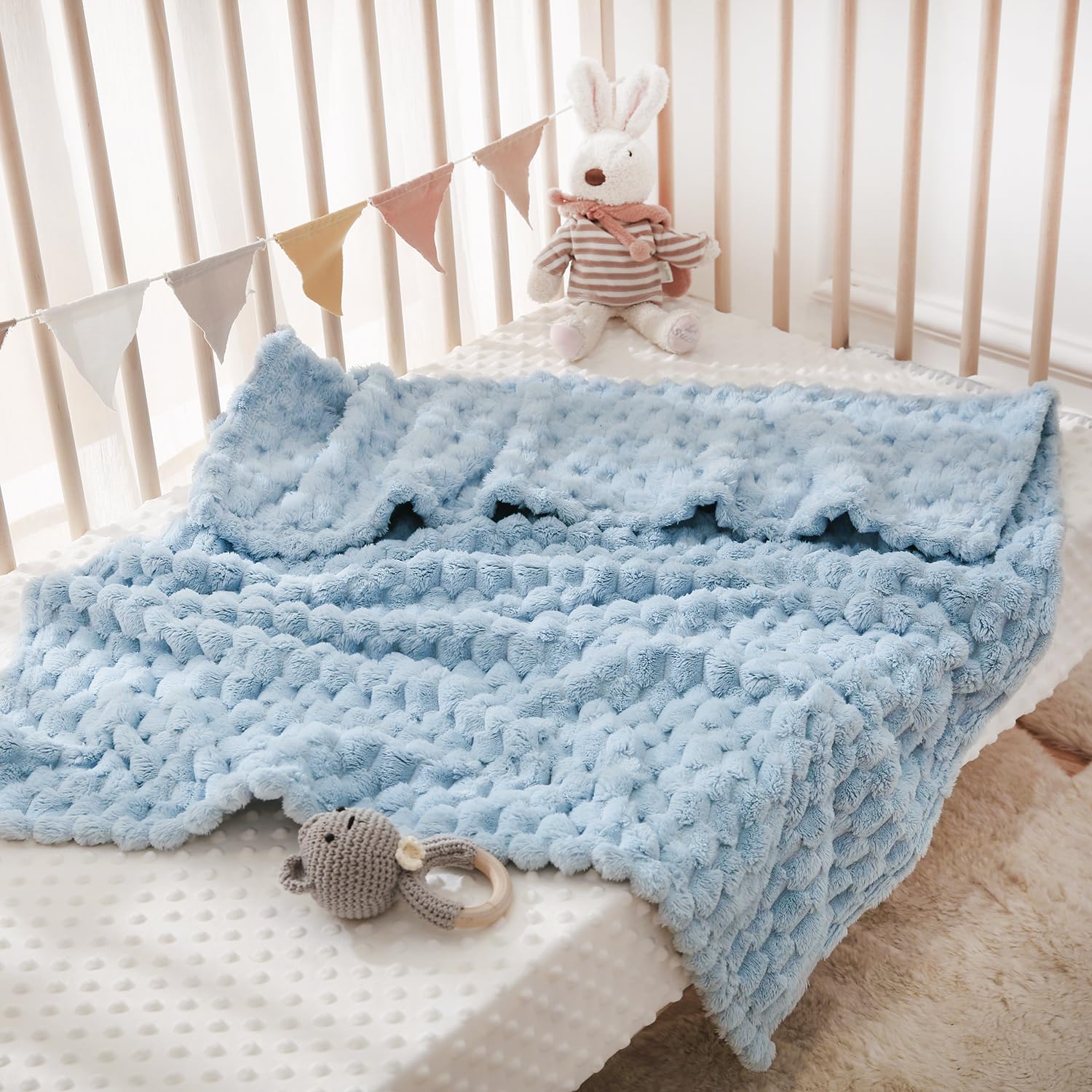 HOMRITAR blanket doubles as chic nursery decor and warmth.