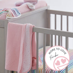 HonestBaby changing pad cover rainbow stripe elastic—secure fit during diaper changes.