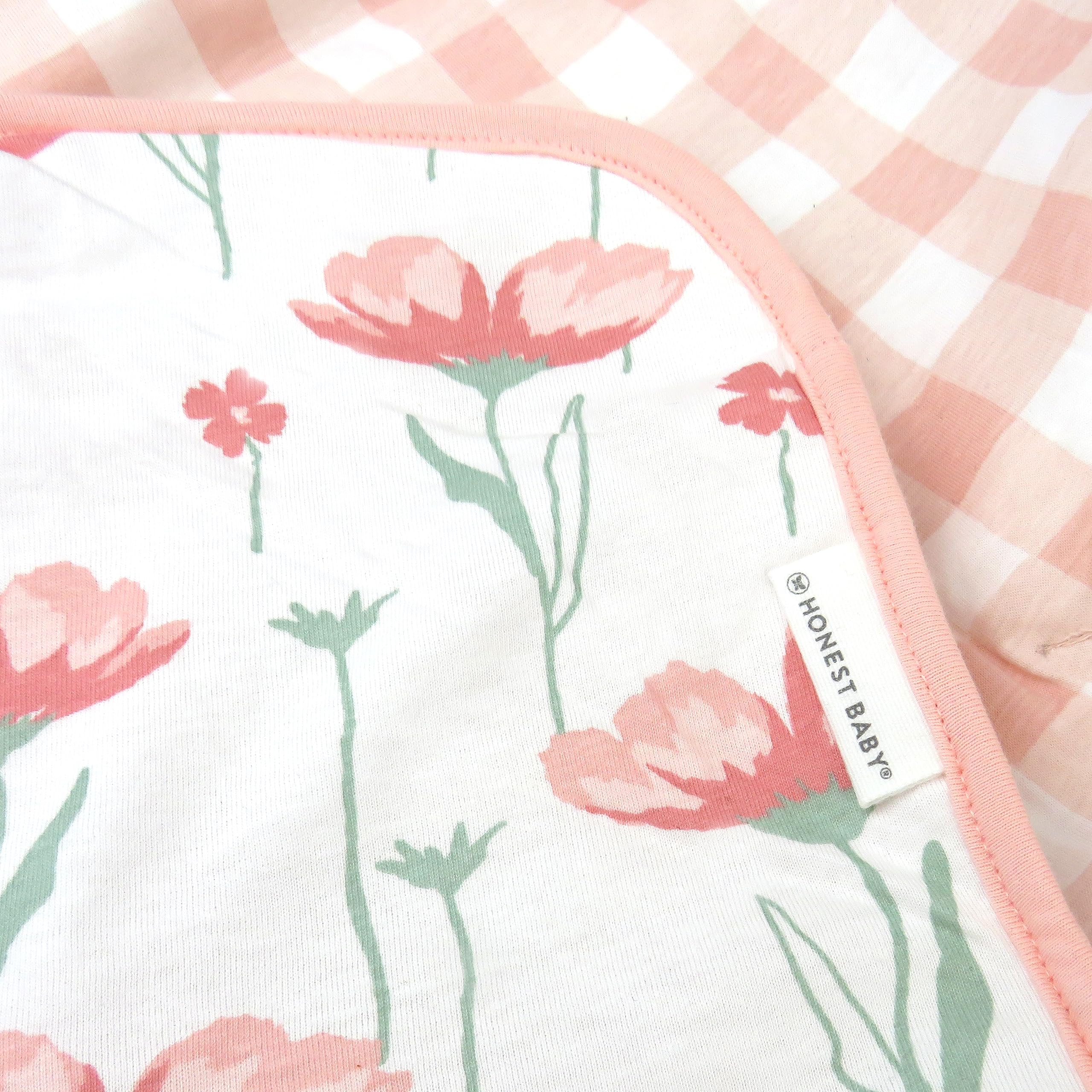 HonestBaby blanket draped in nursery adds a stylish cozy decor element.