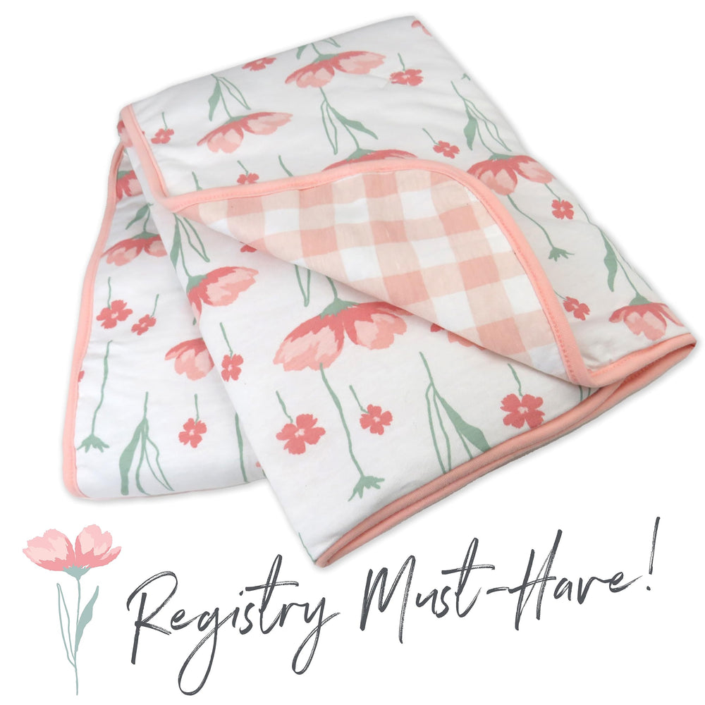 HonestBaby blanket during tummy time supports soft floor play.