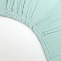 HonestBaby sage crib sheet folded for display shows soft texture and quality.