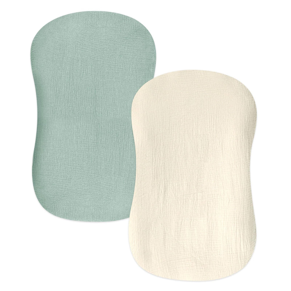 Hooyax baby lounger cover closeup in green wheat reveals breathable muslin cotton for newborn comfort.