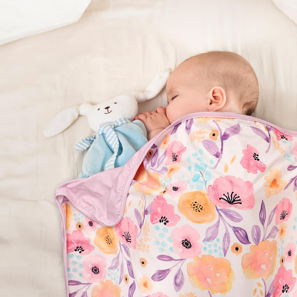 Hooyax double-layer reversible swaddle purple flower — two looks in one convenient blanket.