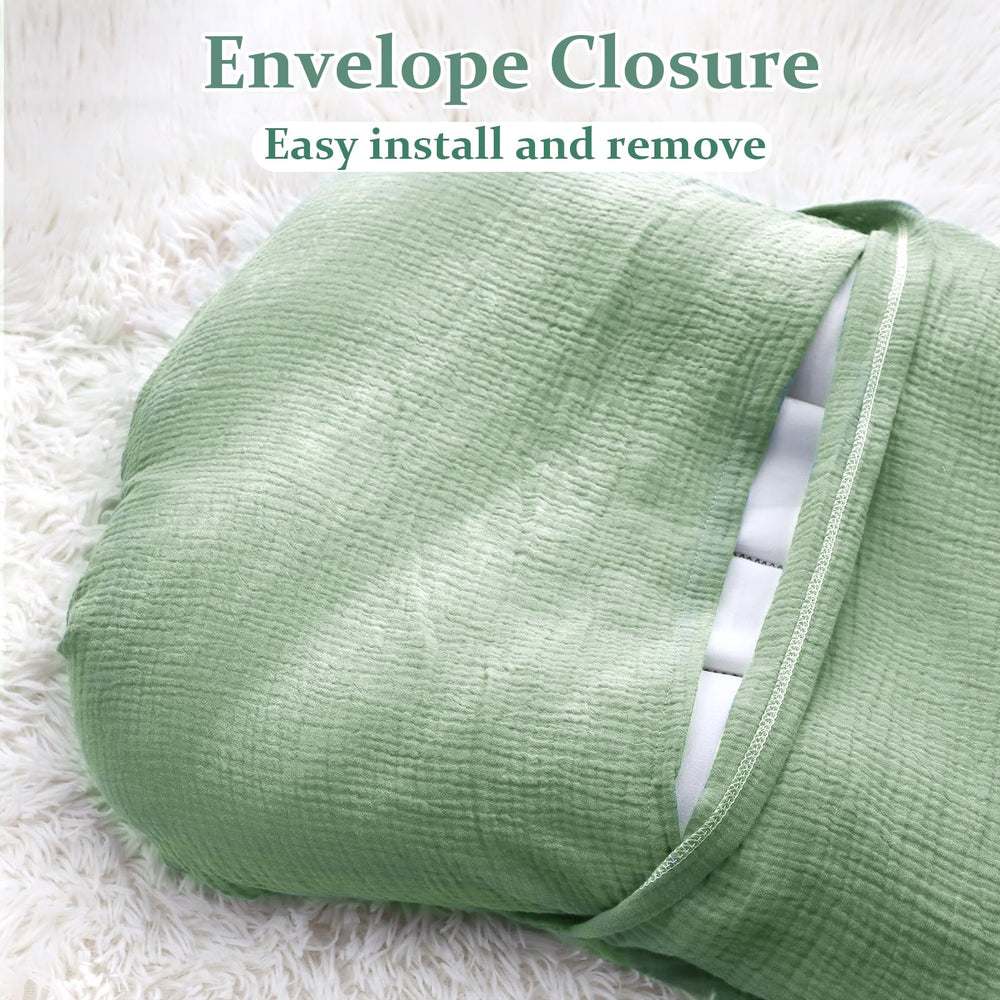 Hooyax muslin baby lounger cover green stitching closeup shows reinforced seams for durability.