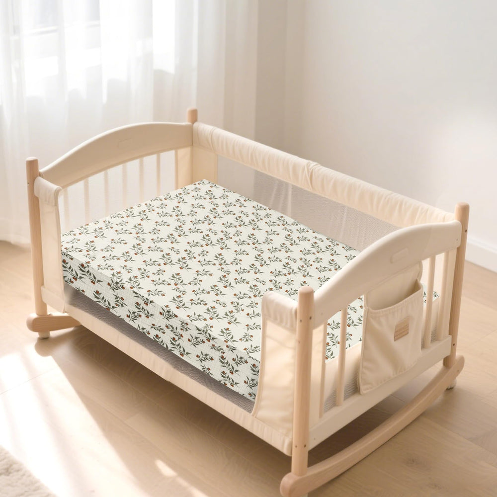 Hooyax muslin bassinet sheets baby sleeping scene demonstrates cozy comfort.