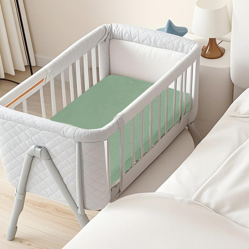 Hooyax muslin bassinet sheets green leaf color adds gentle nursery aesthetic.