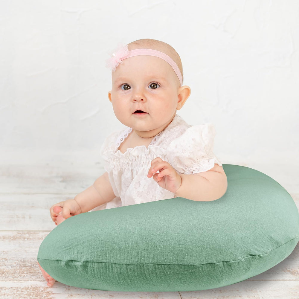 Hooyax muslin nursing pillow cover on pillow showcases breathable fabric for cooler feeding.
