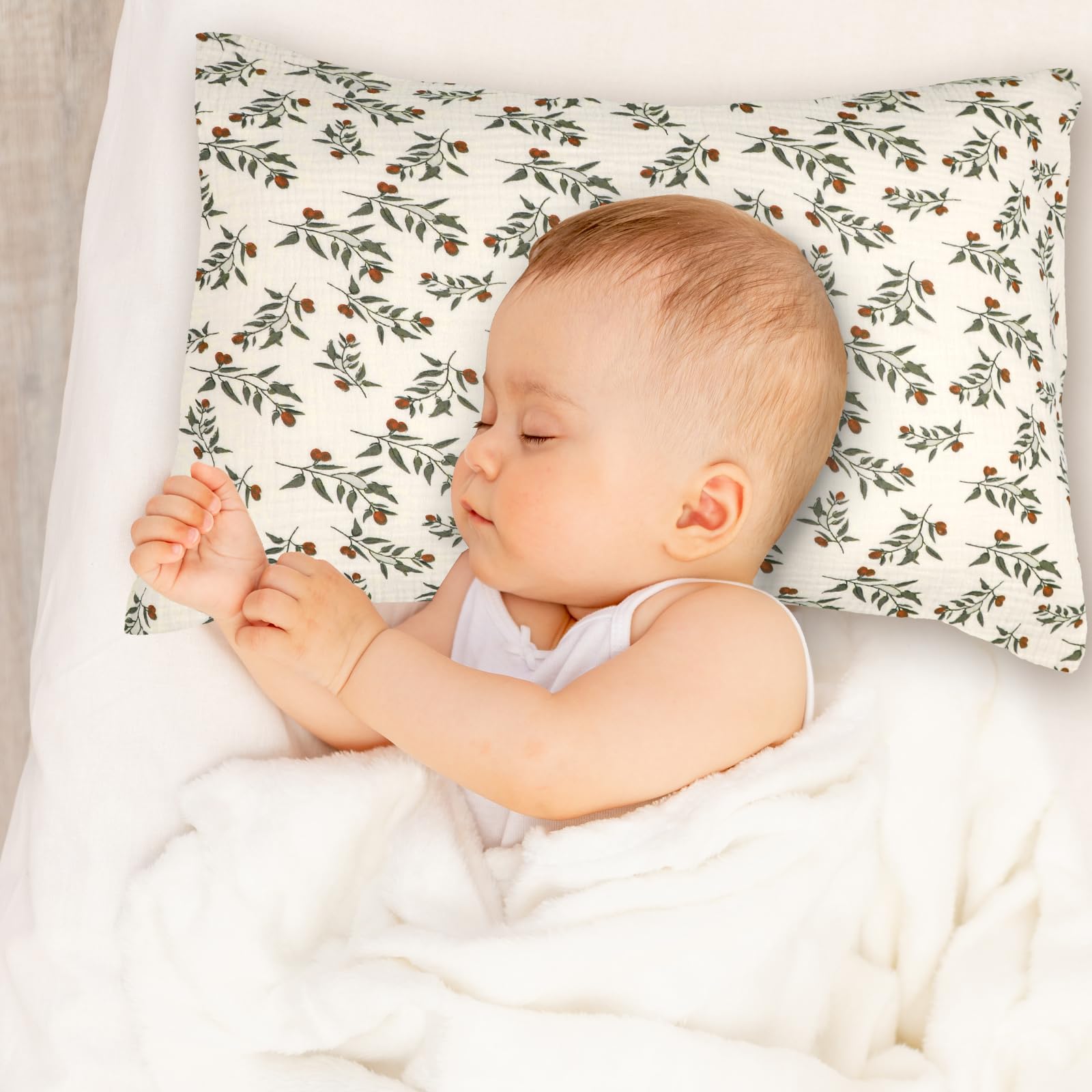 Hooyax leaf-pattern pillowcase paired with crib for gift-ready presentation.