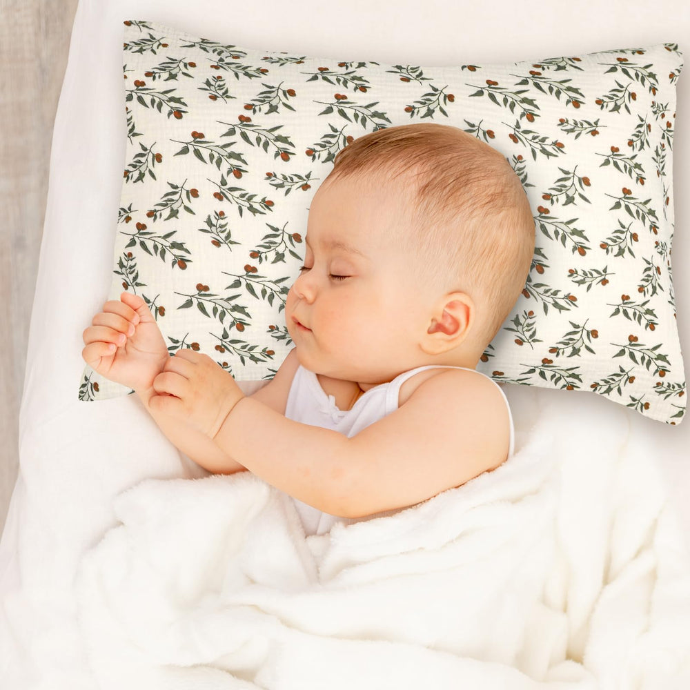 Hooyax leaf-pattern pillowcase paired with crib for gift-ready presentation.