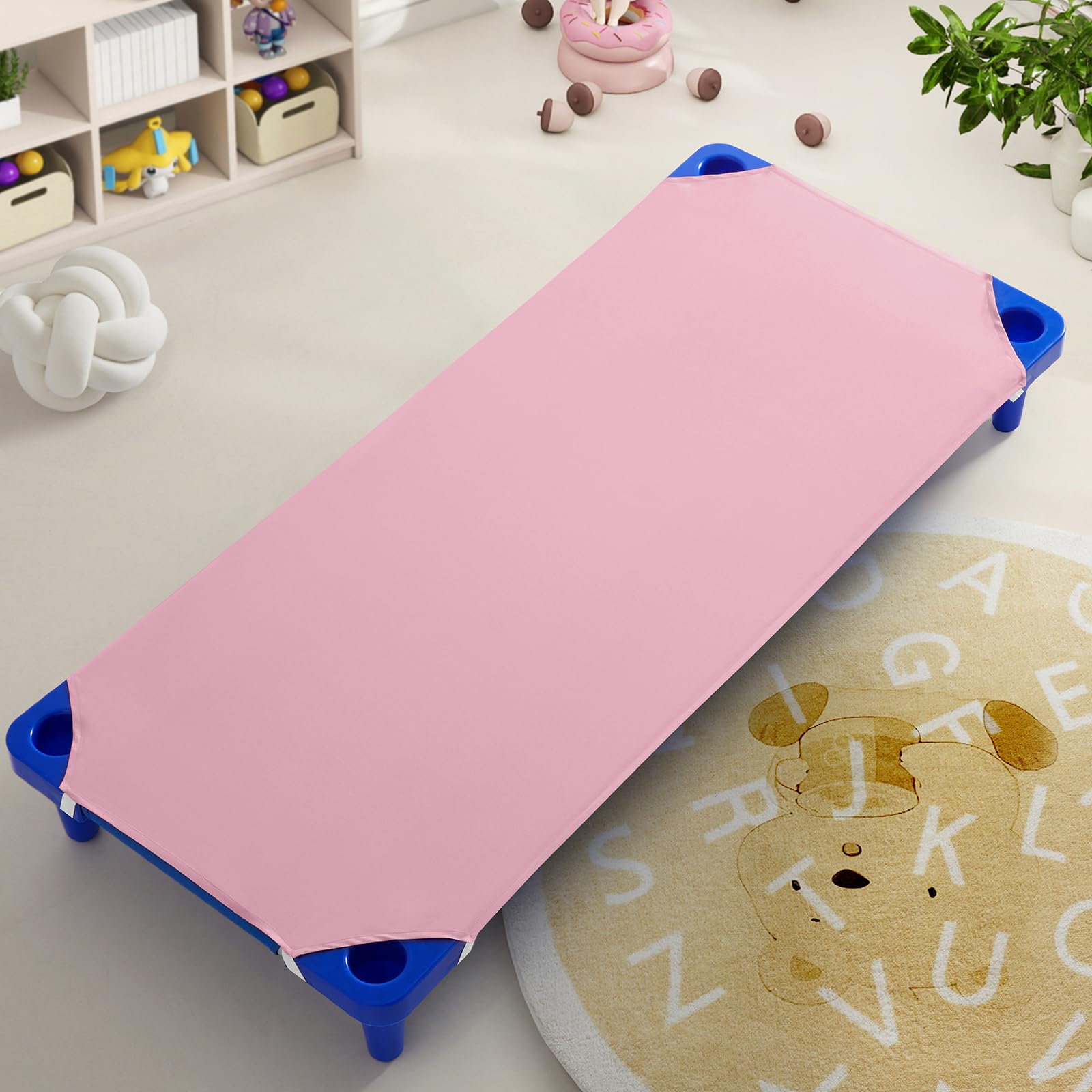 Horbaunal pink cot sheets on a preschool cot provide soft, comfortable sleep space.