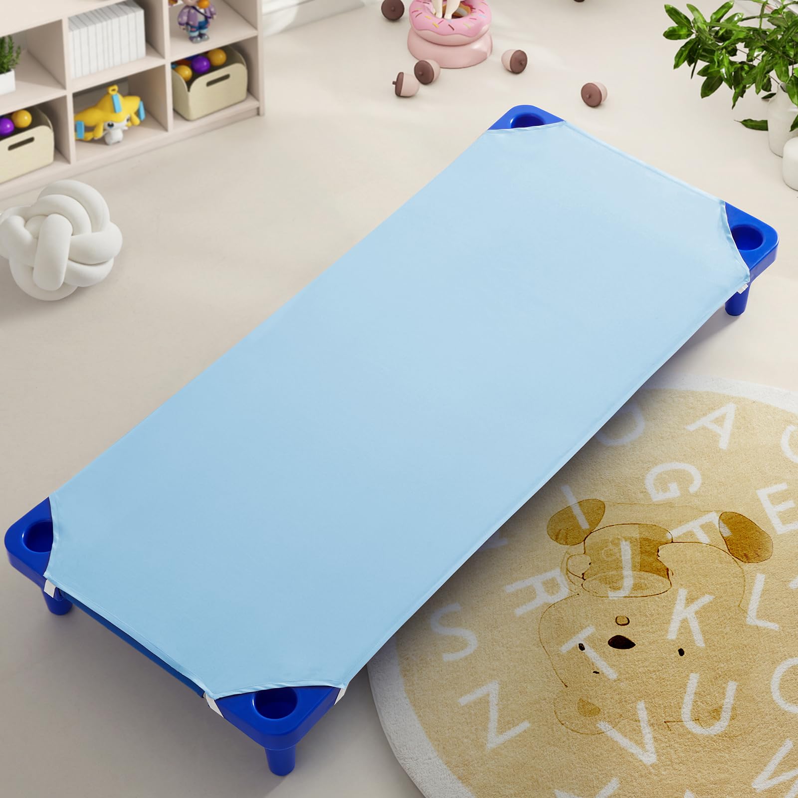 Horbaunal cot sheets on a standard cot demonstrate nap-time readiness and secure comfort