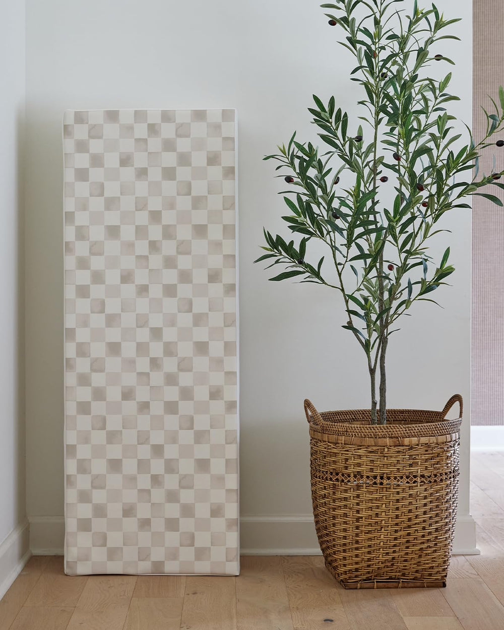 House of Noa checkered almond mat forming a safe play space for curious toddlers.