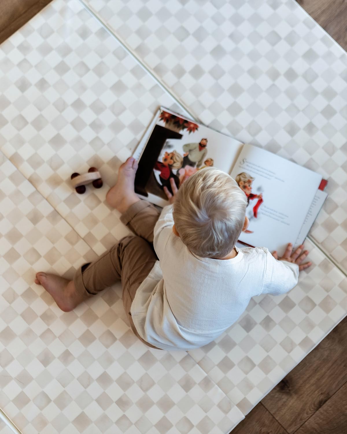 House of Noa mat laid out in living room for family playtime.