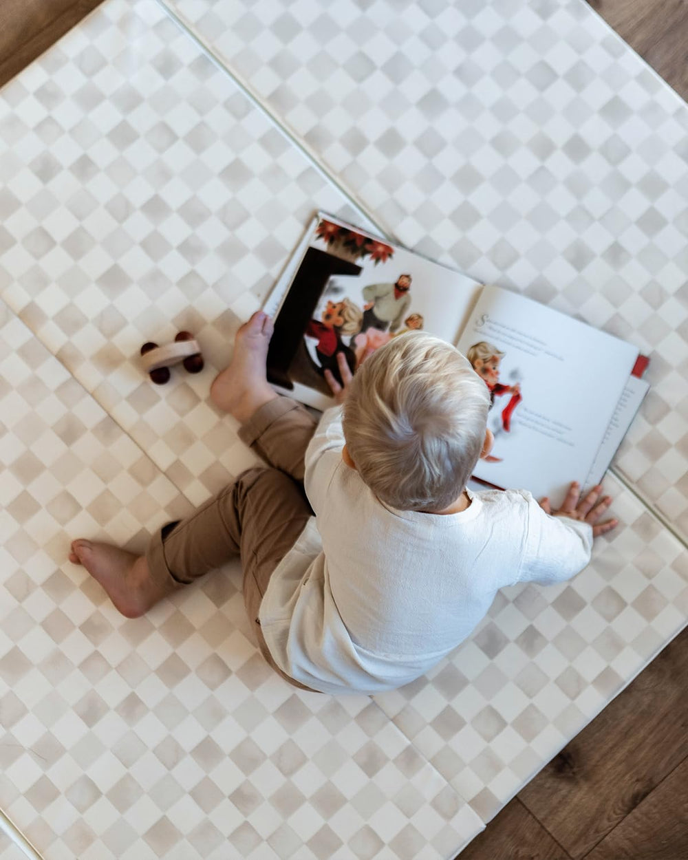 House of Noa mat laid out in living room for family playtime.