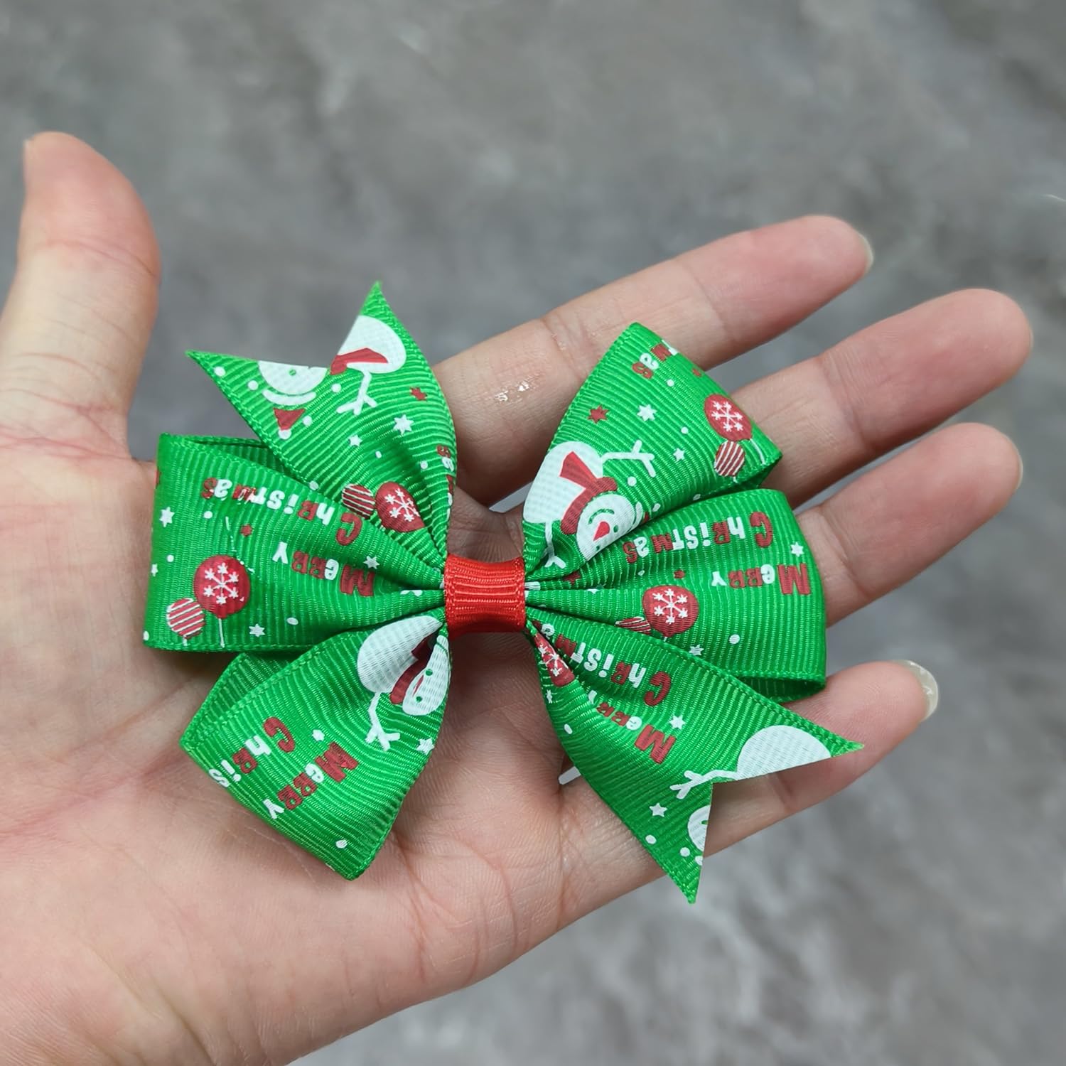 HOXIEYA Christmas bow clip pattern array highlights Santa, reindeer, and snowflakes.