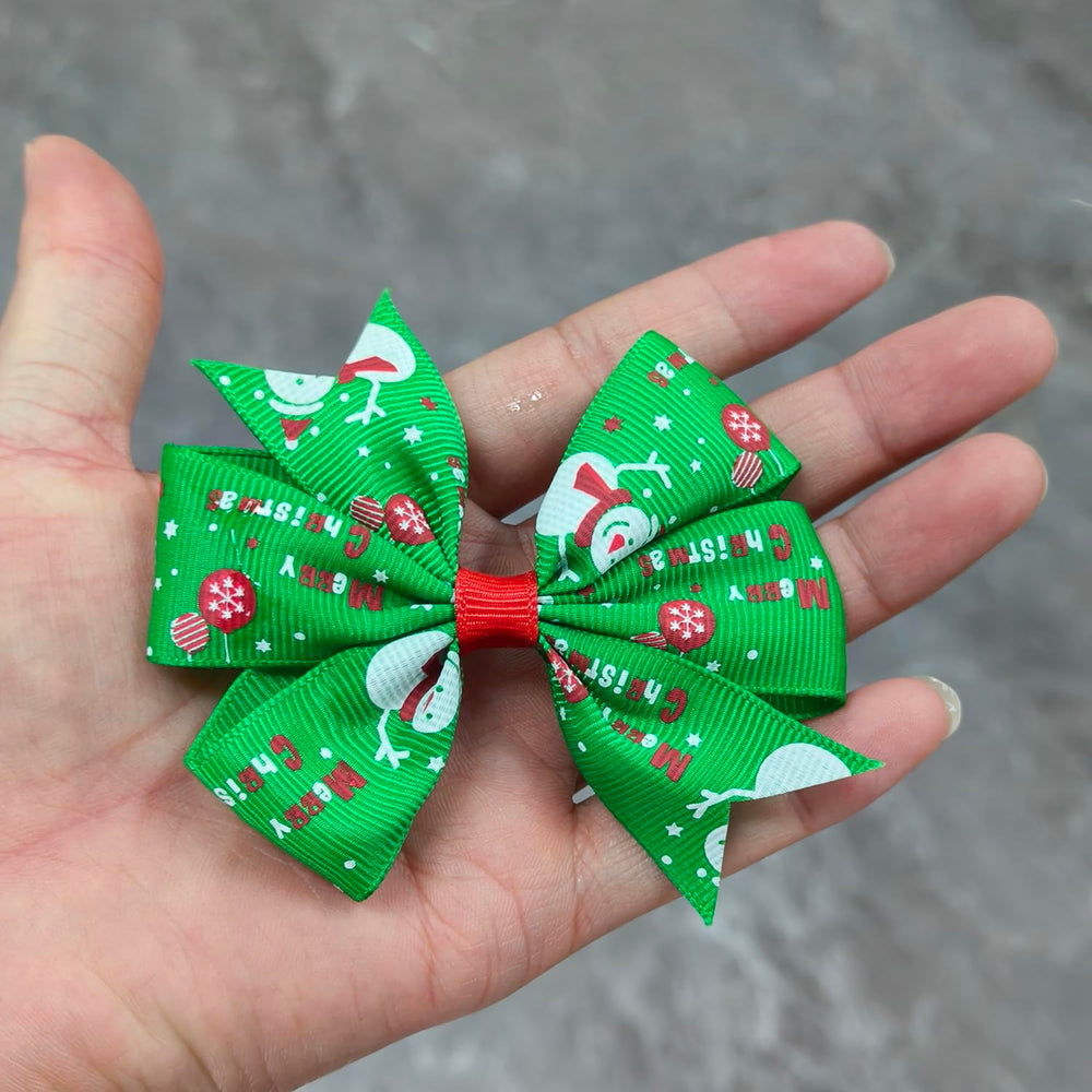 HOXIEYA Christmas bow clip pattern array highlights Santa, reindeer, and snowflakes.