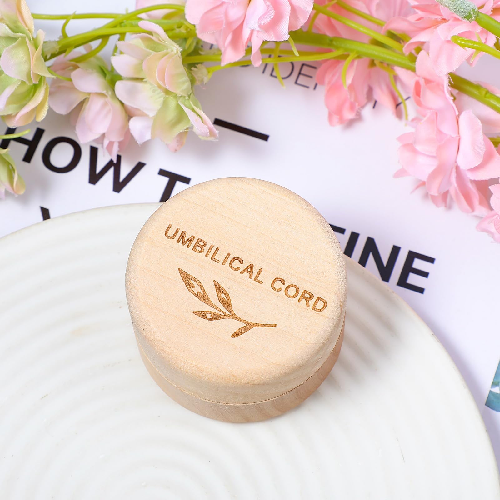 Hpmjz Engraved umbilical cord box with leaf carvings adds warm nursery decor.