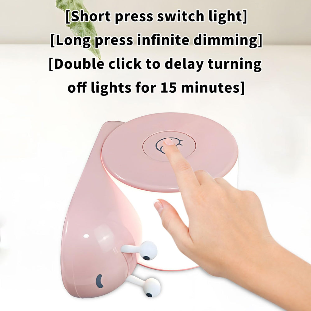 HPYDIY snail night light beside a reading setup for focused tasks