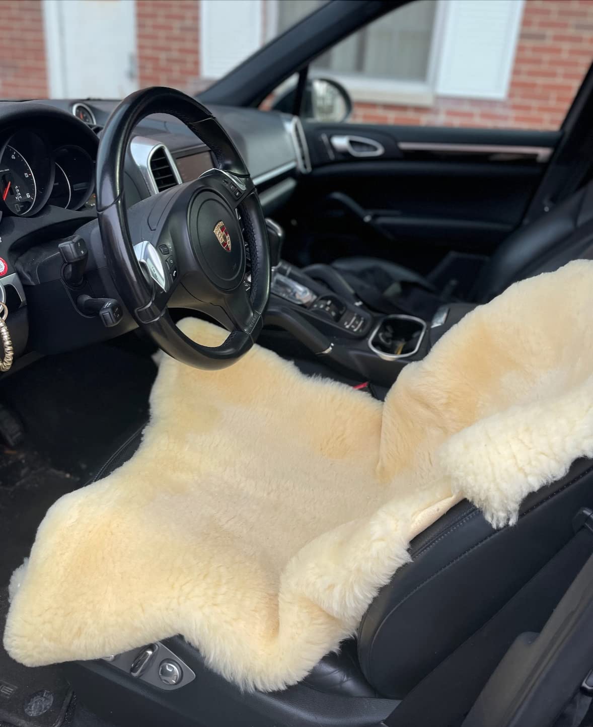 HUAHOO Premium Baby Sheepskin Rug atop mattress as gentle sleep pad example