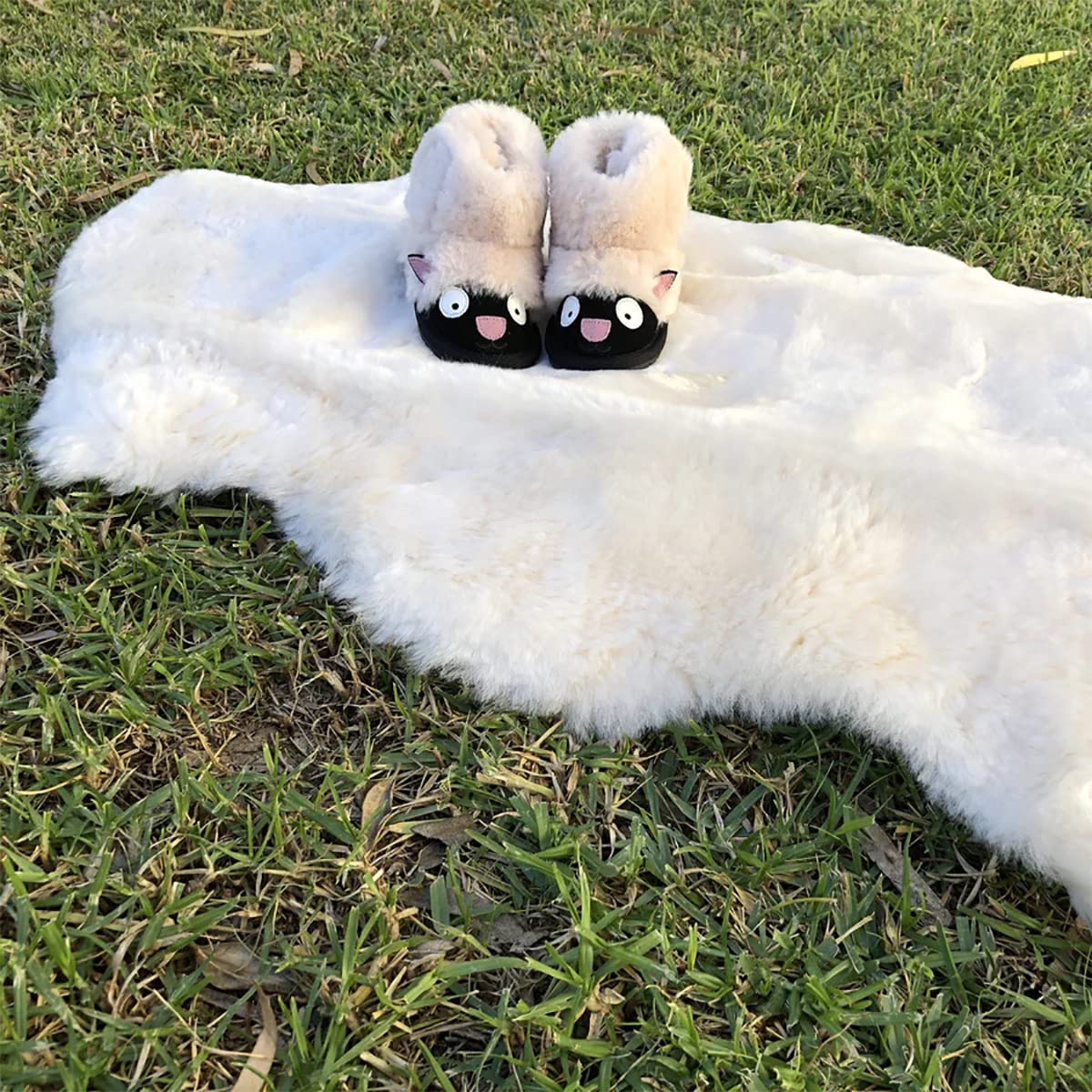 HUAHOO lambskin rug on a play mat provides a gentle surface for tummy time.