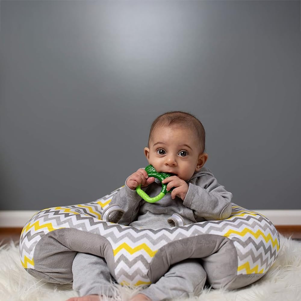 Hugaboo Original Infant Sitting Chair Yellow Chevron in use highlighting adjustable front strap and easy entry
