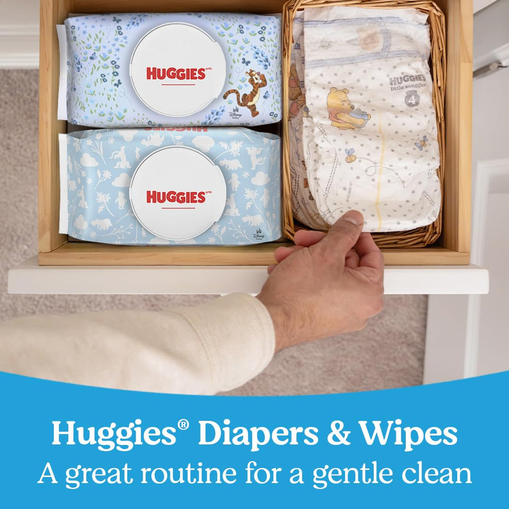 Huggies Natural Care wipes in a diaper bag demonstrate portability for quick refreshes.