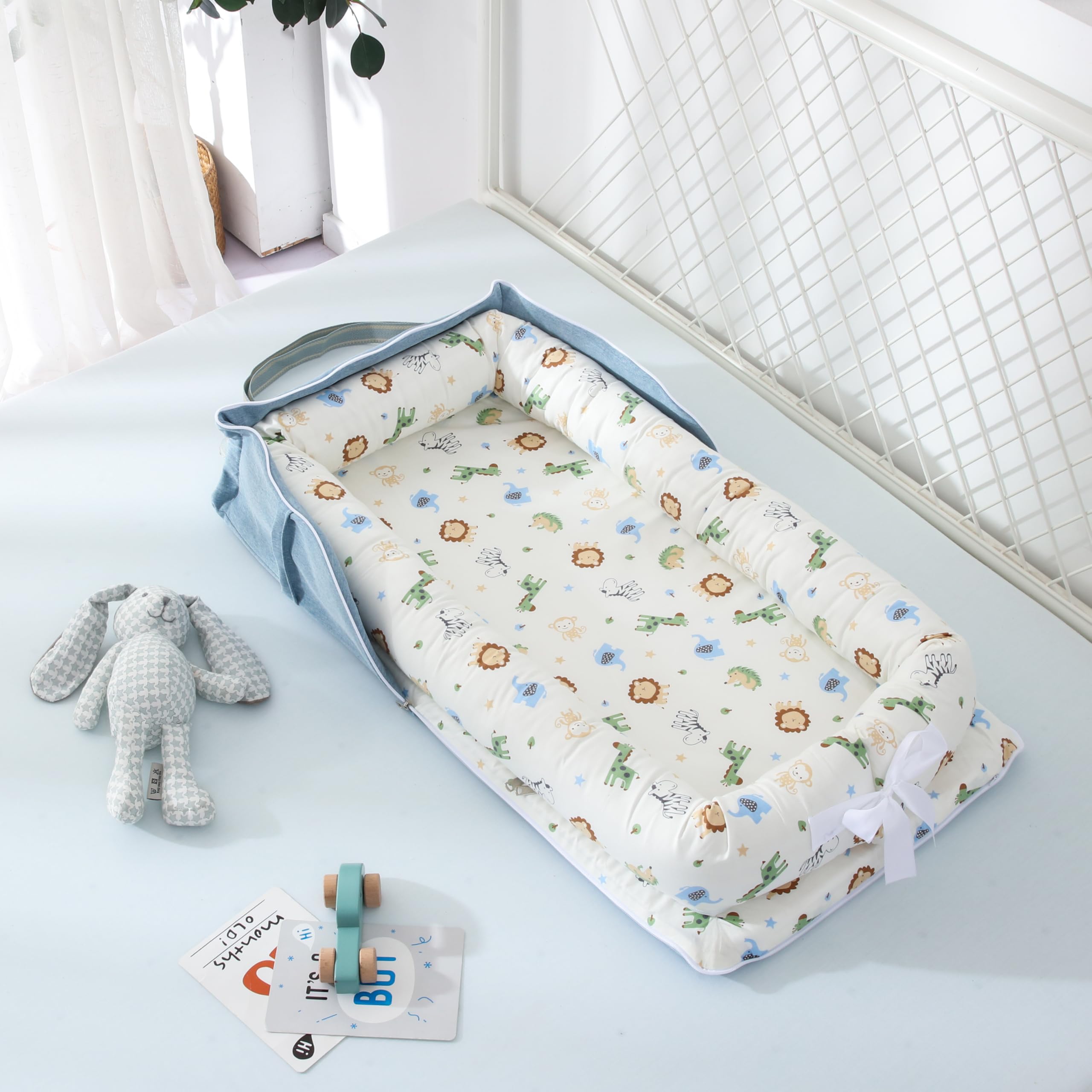 Huggynest Animal Blue lounger supports tummy time and seated play.