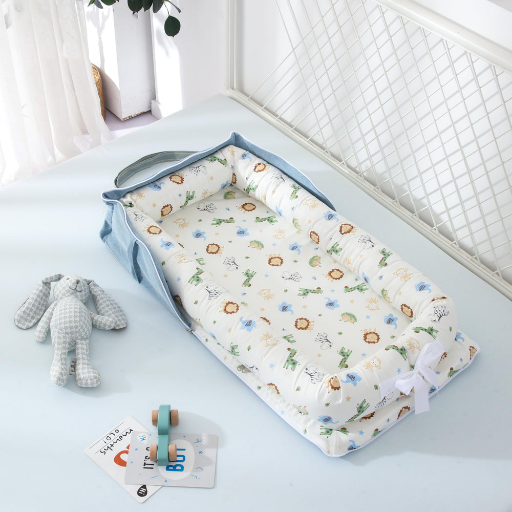 Huggynest Animal Blue lounger supports tummy time and seated play.