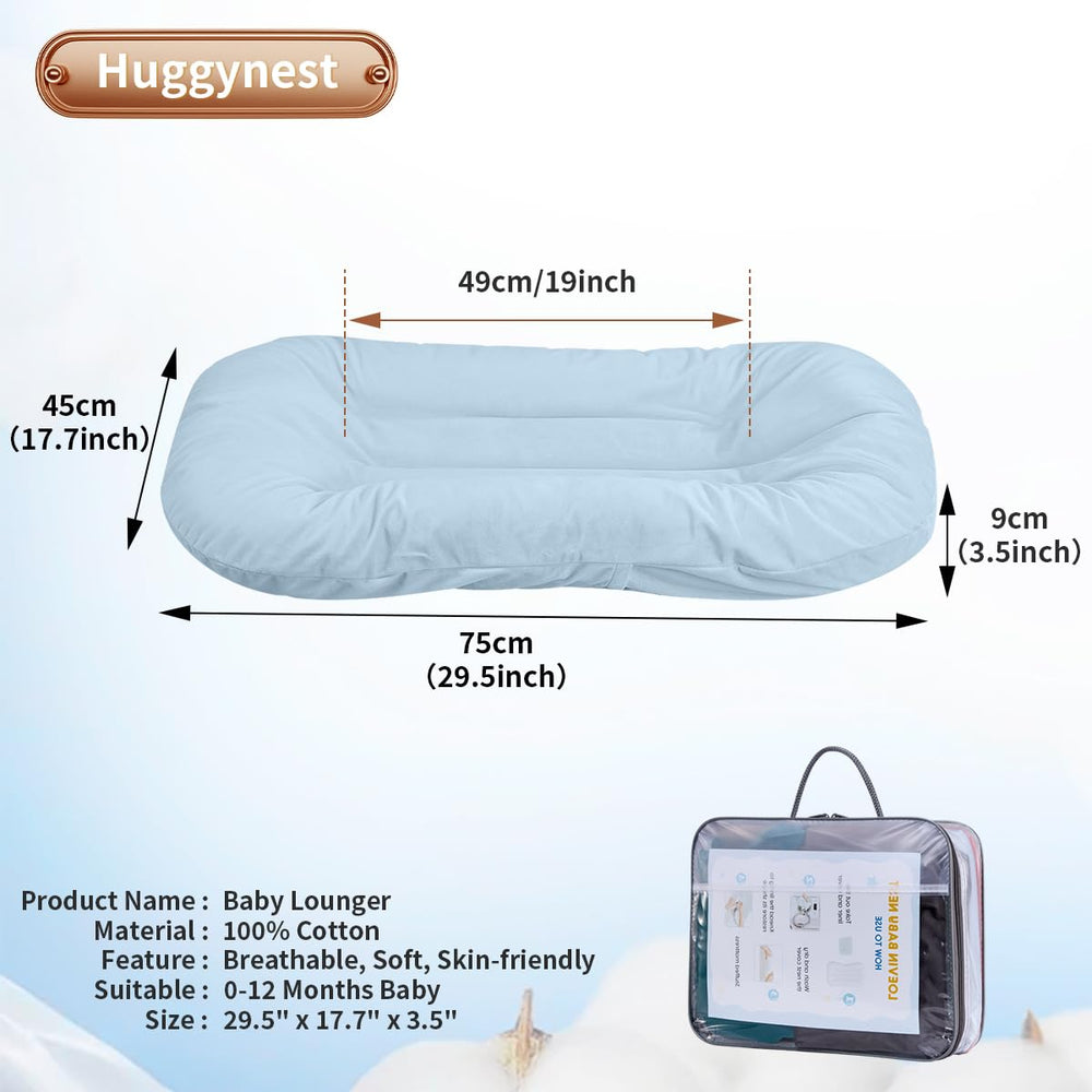 Huggynest blue lounger side view highlights portable infant nest for travel and room-to-room use