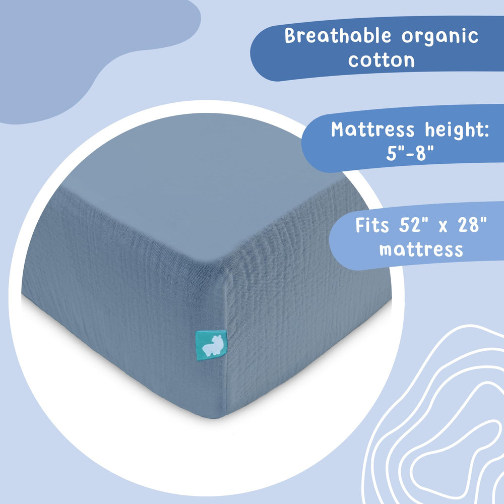 Hugs & Llamas organic muslin crib sheet breathable fabric ideal for warm nights.