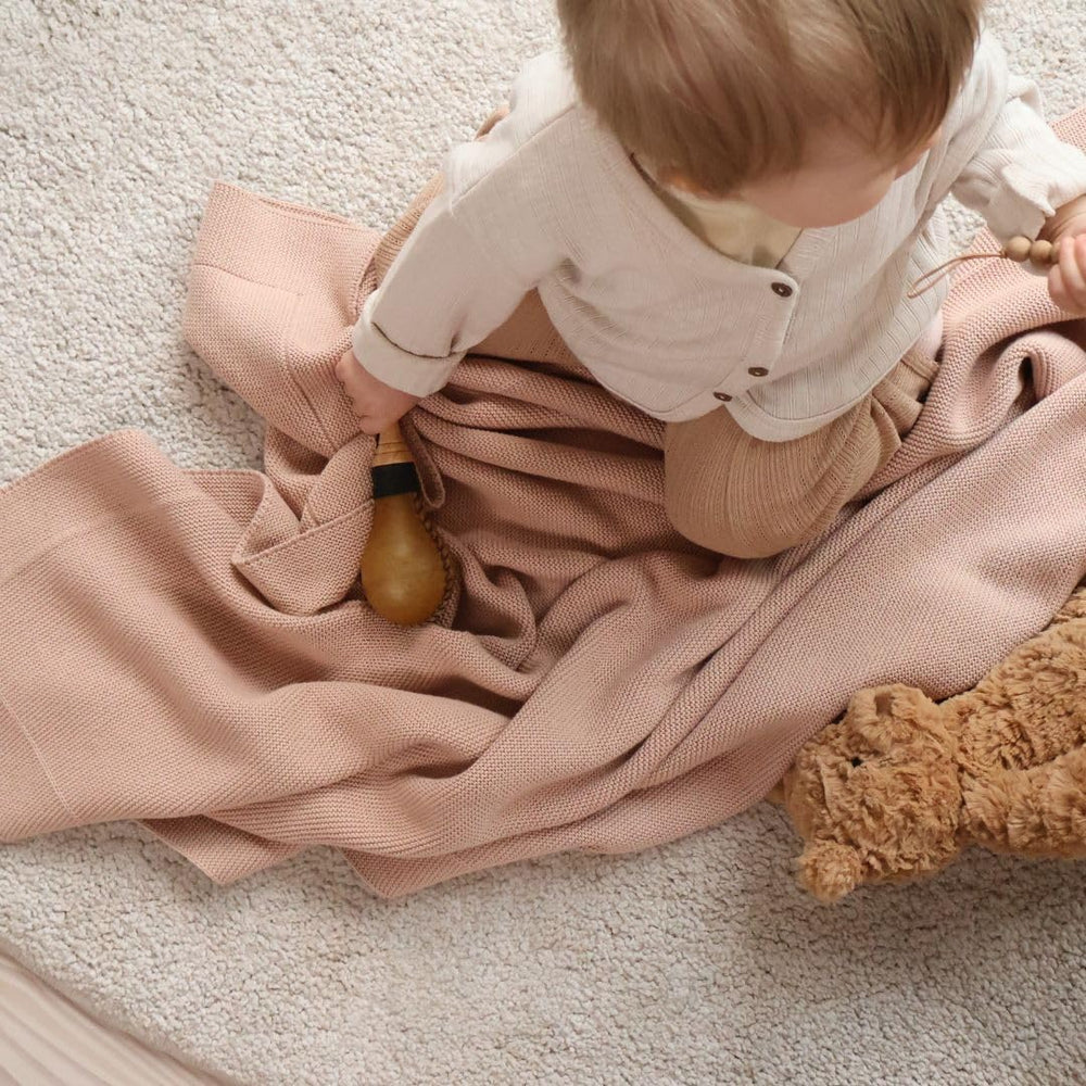 Huxie blanket on crib for comfortable naps and breathable fabric.