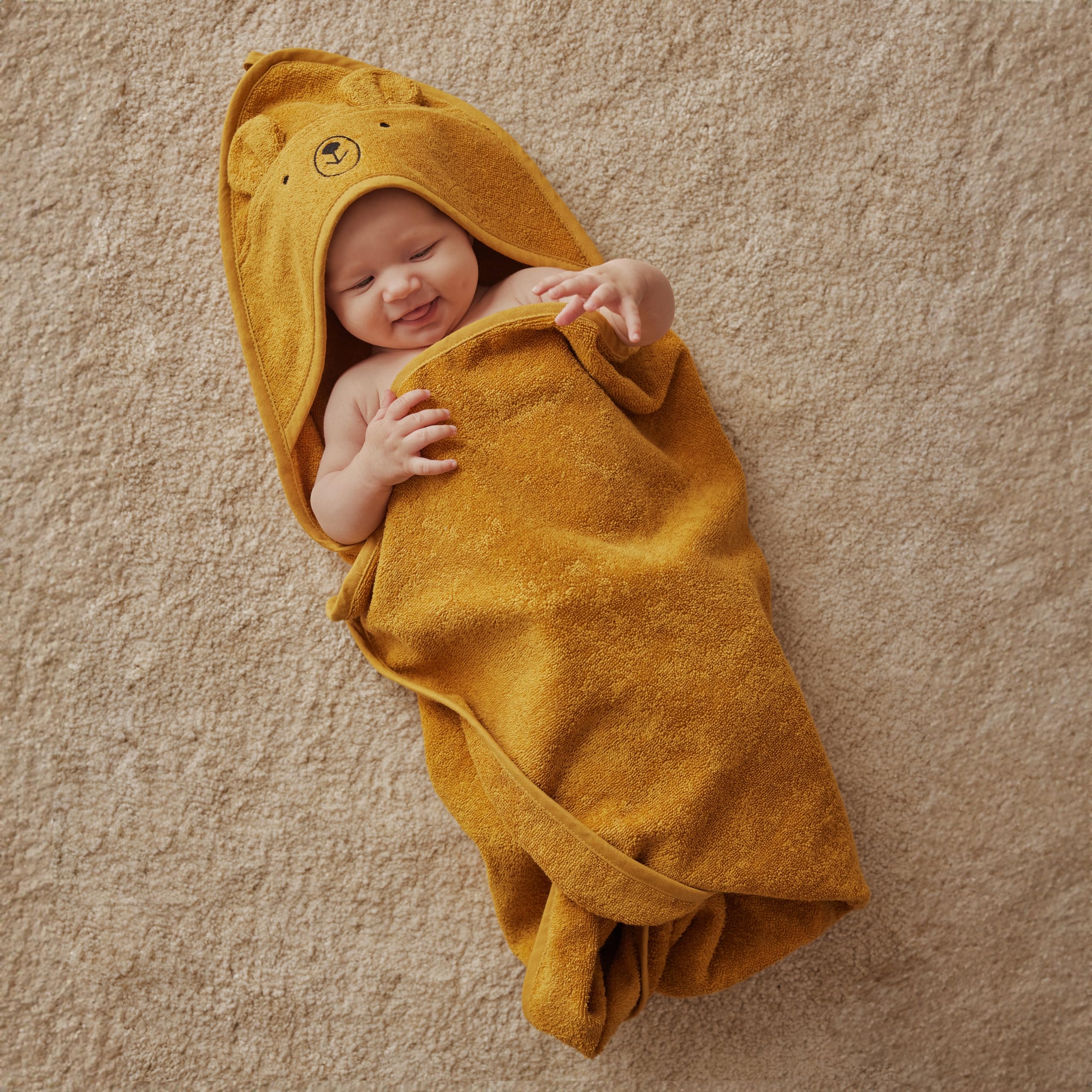 Absorbent terry detail on Huxie towel supports quick drying after baths.