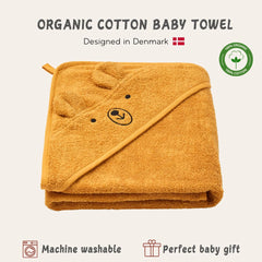 Baby wearing the hood demonstrates cozy wrap with Huxie hooded towel.