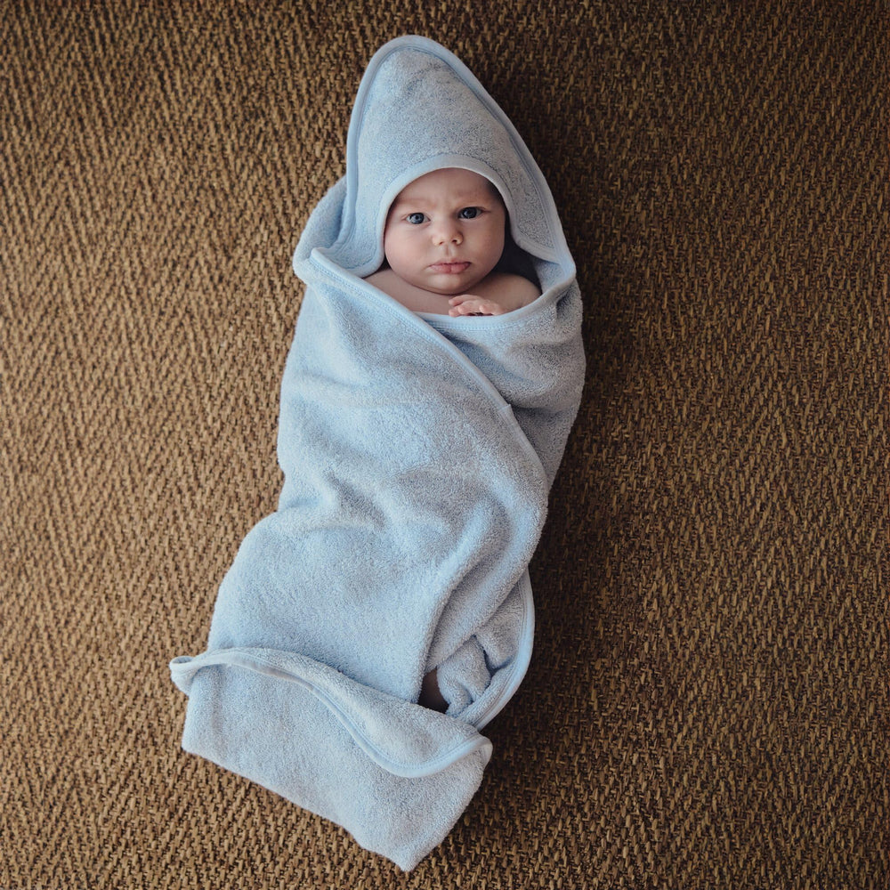 Huxie Baby Hooded Towel blue hood close-up emphasizes cozy post-bath wrap