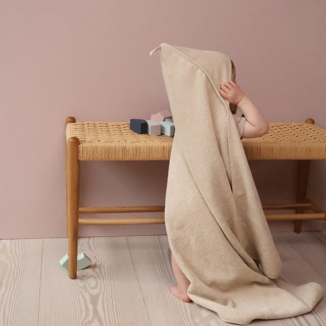 Huxie hooded towel toddler use demonstrates growth from newborn to toddler