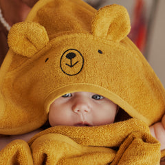 Close-up of plush fabric on the Huxie hooded towel highlights softness.